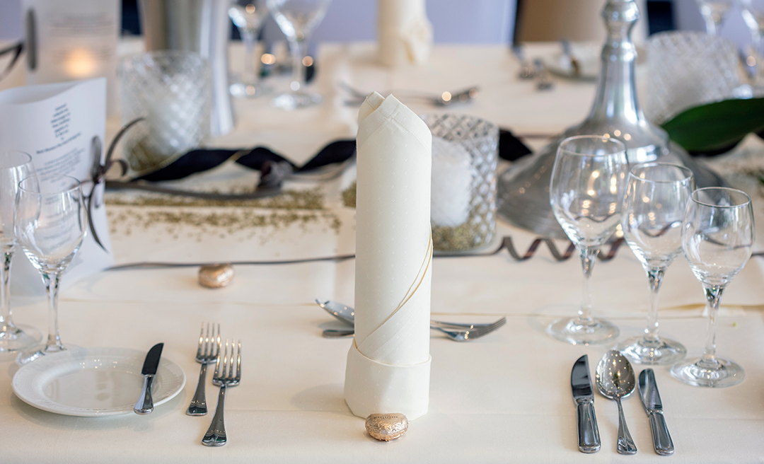 Festive table setting with candles and white napkins